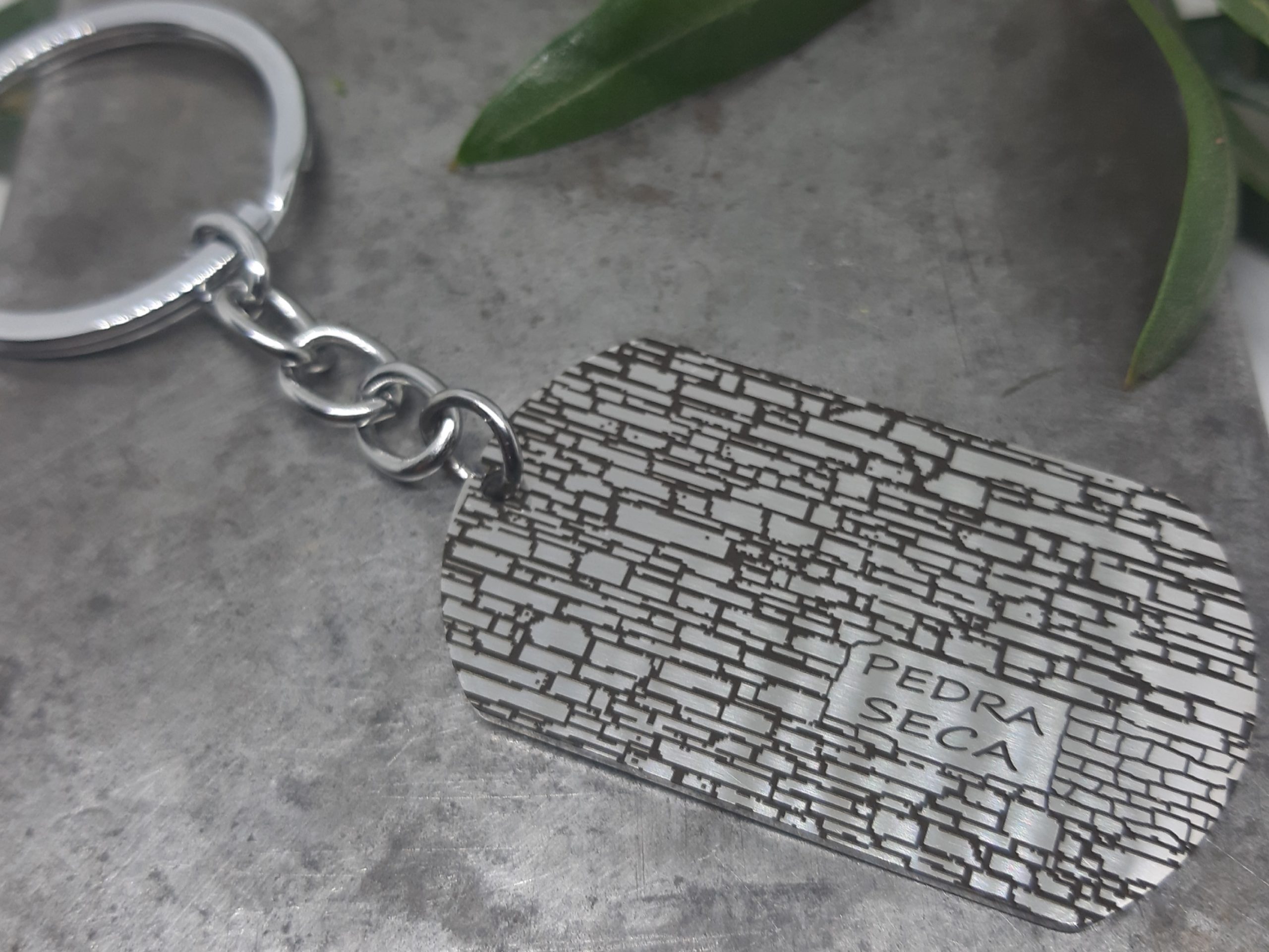 Clauer ovalat Acer dibuix Pedra seca